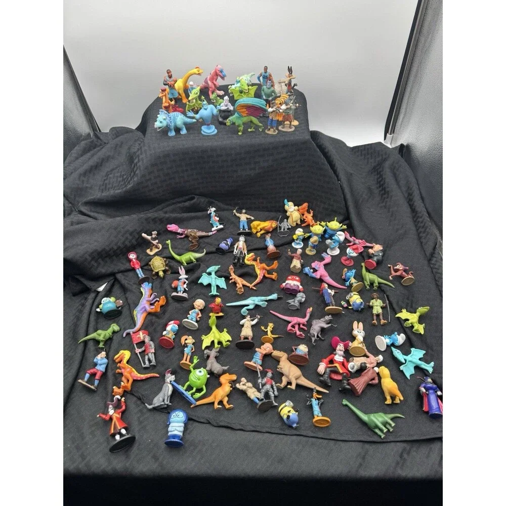 97 Plastic Figurines Including Smurfs, Lion King And Space Jam